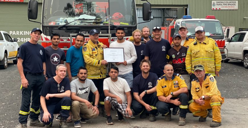 Sam Pokhrel hand over a letter of appreciation to Oakdale Rural Fire Brigade, NSW, 2019